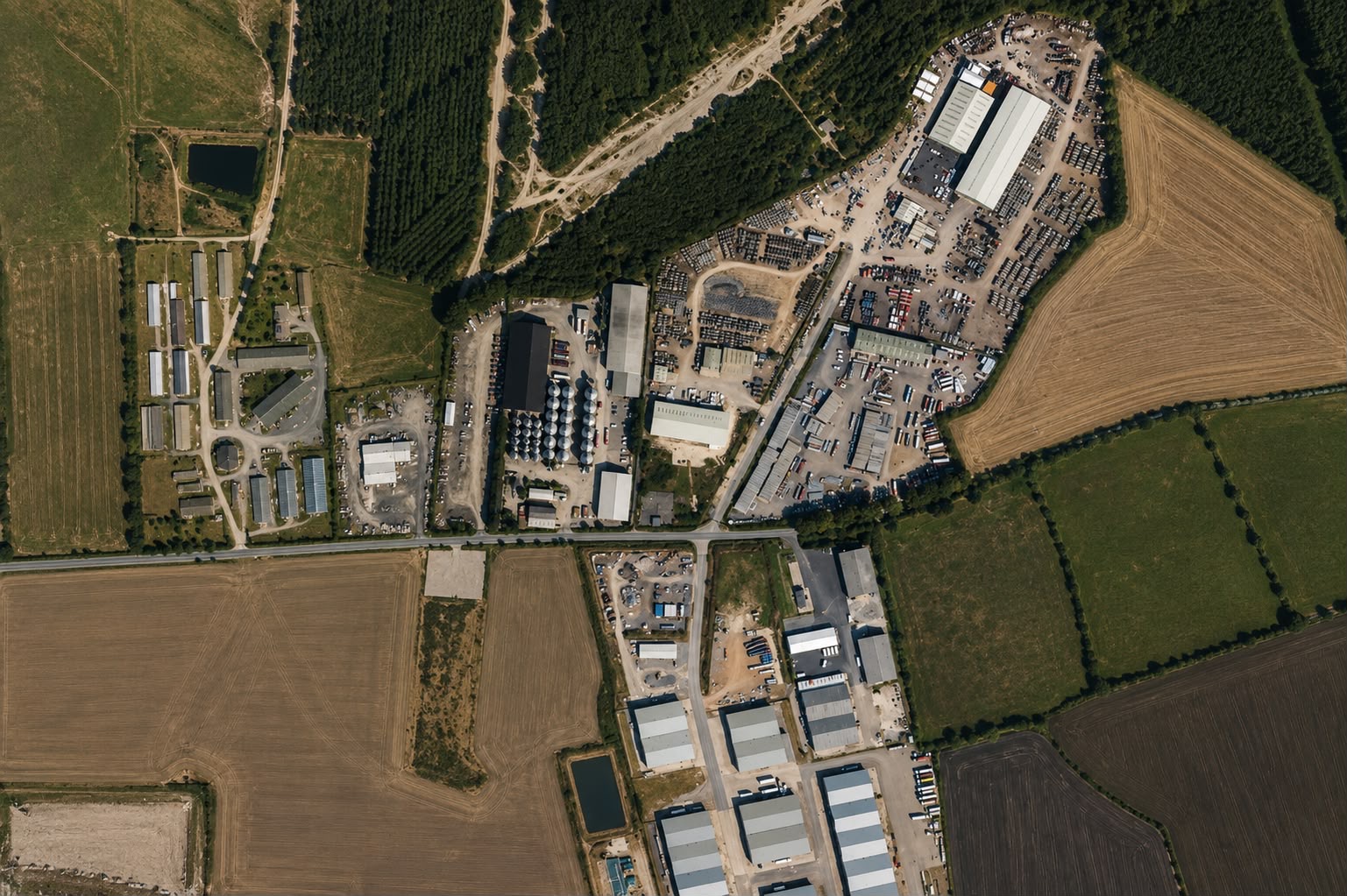 Aerial view of a rural industrial estate surrounded by farmland